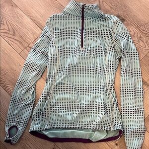 Marikatek dry-wik performance wear zip up top. Size S. Light blue with polka dot